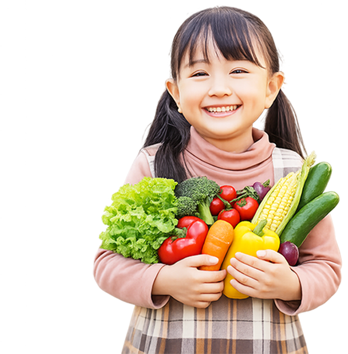 農作物をもつ女の子